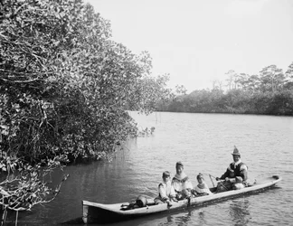 Seminole Indian and Family Dugout Canoe, Miami, Florida, c.1910-20